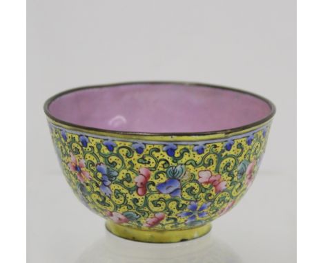 Chinese Canton enamel wine cup of circular form, the yellow ground profusely decorated with flowers and foliate scrolling in 