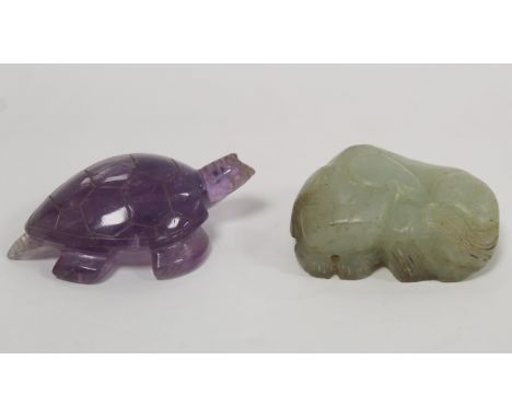 Small Chinese carved celadon jade toggle in the form of a sleeping lion dog, 4.5cm long and a small carved amethyst figure of