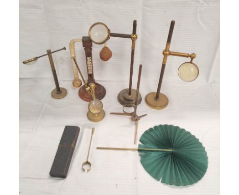 18th century optical shade with brass stem and clamp, in sharkskin box and four condensers on brass bases, also a wet and dry