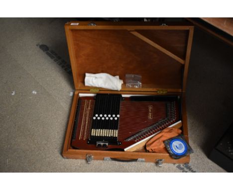 A vintage Zither-Auto harp in wooden case