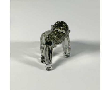 A stunning faceted crystal figure of a baby gorilla in a lovely shade of gray, adorned with smooth black eyes. SCS 2009 compa