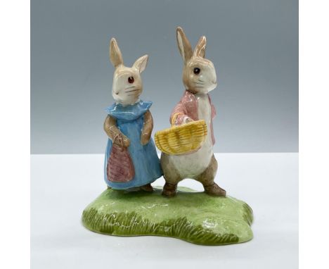 Glossy porcelain. Features two lovely bunnies dressed in blue and red clothes, stand on a green grassy base, Beswick Beatrix 