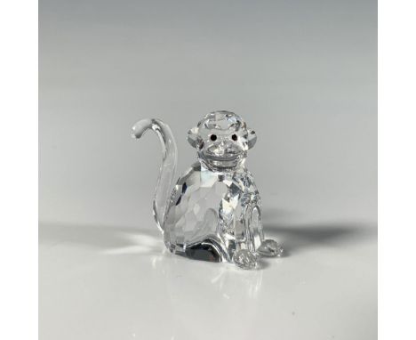 This miniature monkey figure crafted from precision-cut crystal features smooth black eyes and was part of the Chinese Zodiac