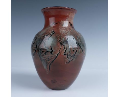 This fabulous vase features desert inspired design on the outside but holds a surprising cobalt translucency when held to the