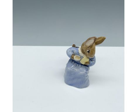 Glossy porcelain figure of a bunny sitting in a chair with a mug and bread. Royal Albert Beatrix Potter backstamp. This item 