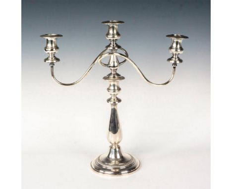 Elegant, 3-light candelabra of knopped baluster shaft on raised foot. Central socket and 2 wraparound and reeded arms, each t