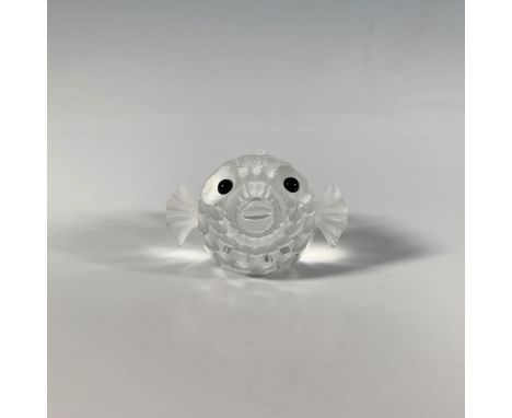 A graceful, faceted figure of a pufferfish, clear and frosted, with black eyes. Part of the South Sea group. Swarovski markin