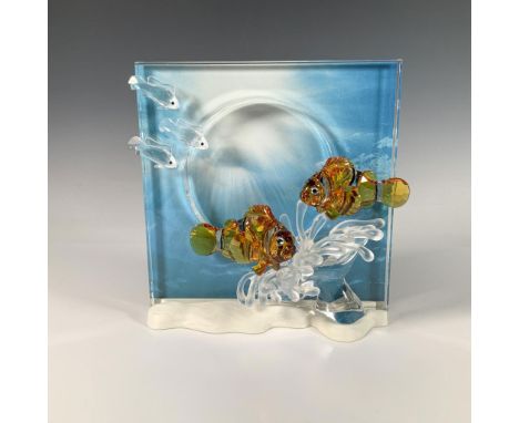 This stunning sculpture is part of the Wonders of the Sea trilogy. It features two topaz crystal clownfish swimming near a cl