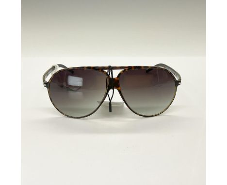 These sporty wraparound sunglasses feature a chic animal-print Havana design complemented by sleek grey gradient lenses. The 