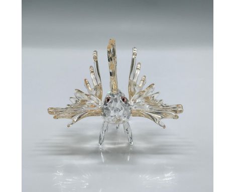 This spectacular figure is made from clear crystal with light amber colored fins and salmon colored eyes. This item has its o