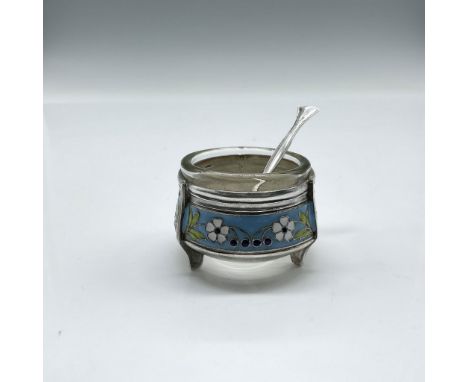 Precious etched design colored in blue, white and green over metal 3 leg form with glass insert. Silver spoon serving utensil