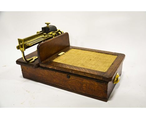 A set of Edwardian scales by W&amp;T Avery Ltd Birmingham, oak body with brass fittings, 26cm high, 51cm long, 32cm wide