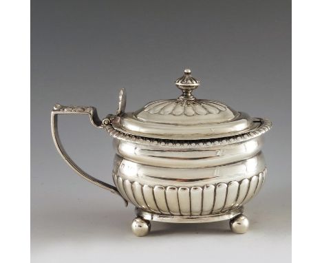 Rebecca Emes and Edward Barnard, London 1814, a George III silver mustard pot of oval part fluted form, gadrooned rim and hin