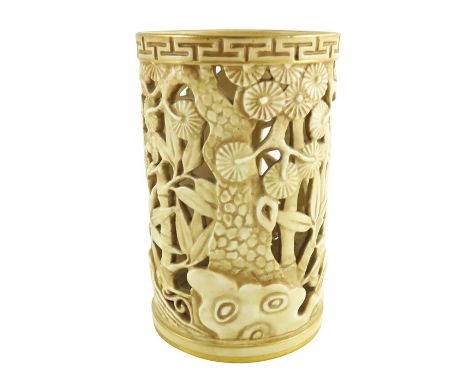 A Royal Worcester reticulated and relief moulded vase, 1907, modelled as a Chinese brush pot, ivory finish with gilt rims, in