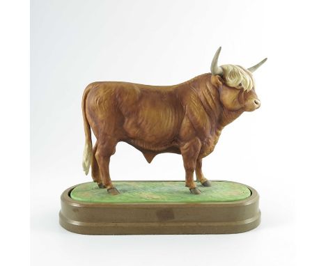 Doris Lindner for Royal Worcester, a porcelain figure of a Highland Bull, 1977, decorated in coloured enamels and raised on a