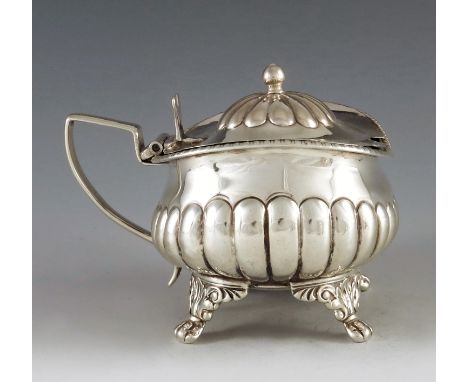 Stephen Adams, London 1818, a George III silver mustard pot, half reeded rectagular baluster form on four cast foliate bracke