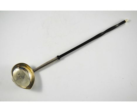 A George II silver punch ladle, London 1736, oval form with pinched spout, twisted horn handle, 39.5cm long, 3.28ozt total