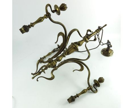 An Arts and Crafts brass three light pendant chandelier, circa 1900, in the Art Nouveau style, sinuous tendril and whiplash f