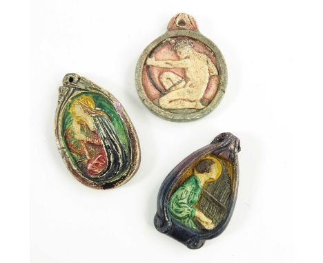 Mary Watts for Compton Pottery, three ceramic pendants, relief moulded, including St Catherine, St Cecilia and Sagittarius, 5