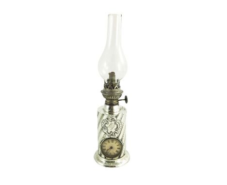 A Victorian silver table oil lamp clock, James Deakin and Sons, Sheffield 1889, cylindrical form, wrythen fluted and reeded, 