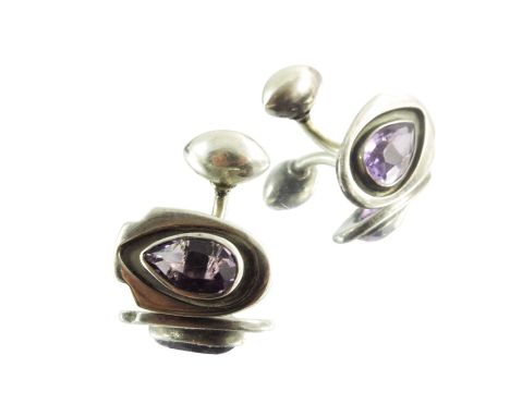 Kalo Shop, a pair of Arts and Crafts silver and amethyst cufflinks, teardrop stones within shiled shaped cartouches, signed, 