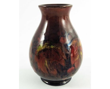 William Moorcroft, a flambe Leaf and Berry vase, circa 1930, baluster form, impressed and painted marks, 15cm high