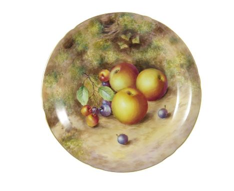 Freeman for Royal Worcester, a fruit painted dish with leaf and moss background, signed Freeman, with gilt gadrooned border, 