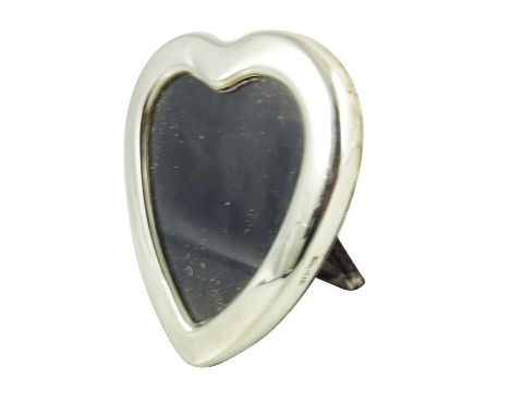 An Elizabeth II silver photo frame, Carr's of Sheffield, Sheffield 1986, heart form, easel back, opening 8cm x 7cm, 11cm x 10