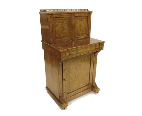 A Victorian figured walnut Bonheur du Jour or writing desk, the pull out drawer with Moroccan leather surface, below cupboard