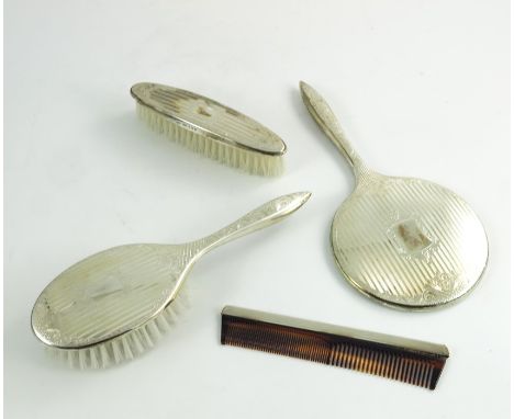 An Elizabeth II silver backed dressing set, W I Broadway and Co., Birmingham 1992, engine turned stripe and etched floral cha