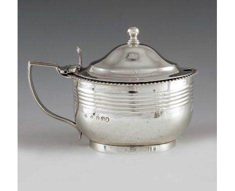 Crispin Fuller, London 1809, a George III oval silver mustard pot with moulded girdle and reeded decoration and with gadroone