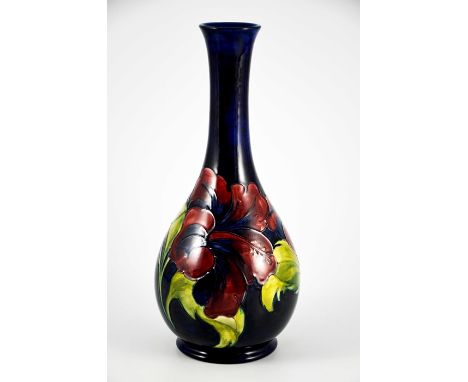 Walter Moorcroft, a Hibiscus vase, circa 1960s, elongated neck baluster form, on blue, impressed marks and underglaze green m