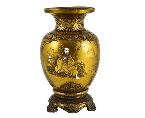 A Japanese Shibayama gold lacquered vase, Meiji, shouldered form on integrated ogee bracket base, decorated with two relief m