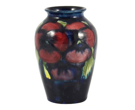 William Moorcroft, a small Pansy on blue vase, circa 1925, impressed marks, underglaze blue monogram, 10.5cm high