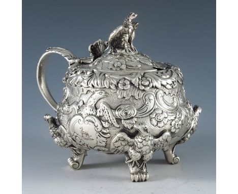 William Eaton, London 1820, a George III silver mustard pot, squat baluster inverse pear form, heavily cast and embossed with