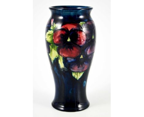 William Moorcroft, a Pansy on blue vase, circa 1925, elongated inverse baluster form, impressed marks and underglaze teal mon