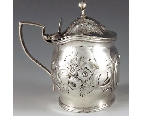 John Gold, London 1801, a George III silver mustard pot of navette form, the body with moulded and chased with leaf and flowe