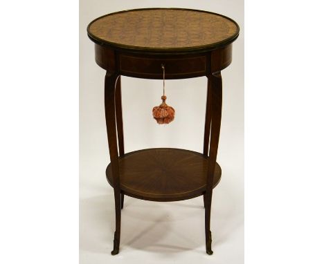 A Louis XV style French Kingwood and parquetry inlaid occasional table, with gilt metal mounts, circular form, geometric top 