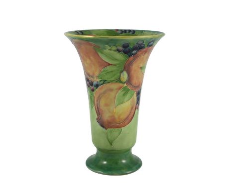 William Moorcroft for James MacIntyre, a Pomegranate on green vase, circa 1910, footed trumpet form, impressed number and und