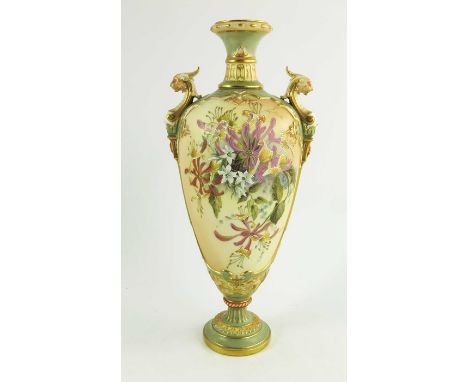 A Royal Worcester blush ivory ground two handled urn shape vase florally decorated in coloured enamels including honeysuckle 