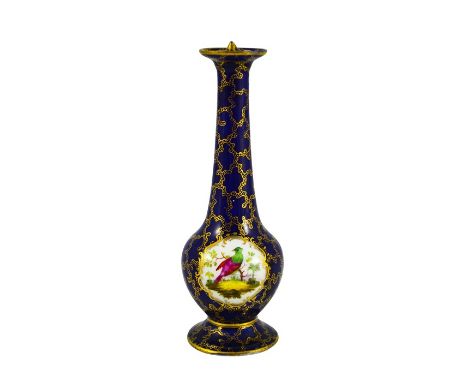 A porcelain sprinkler bottle, elongated baluster form with ogee foot, gilt over blue seaweed ground with cartouches of exotic