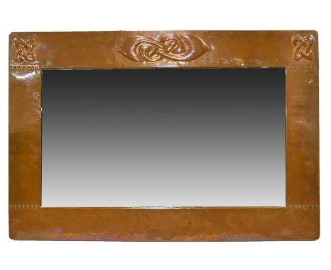 Archibald Knox for Liberty and Co., an Arts and Crafts copper mirror, rectangular, repousse decorated and riveted, with Celti