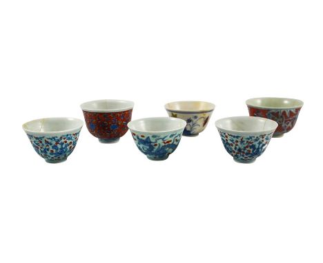 Six Chinese Doucai and enamelled bowls, Chenghua marks, variously decorated bel form with underglaze blue foliate scroll, dra