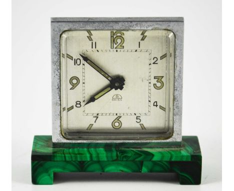An Art Deco malachite and chrome timepiece, circa 1930, the square silvered clock face with luminescent Arabic numerals, on a