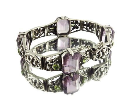 Sybil Dunlop, an Arts and Crafts silver, amethyst and peridot bracelet, emeral cut purple stones in open foliate settings, un