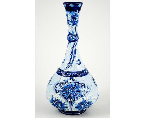 William Moorcroft for James MacIntyre, a Florian Ware Cornflower bottle vase, circa 1899, onion form with elongated knopped n