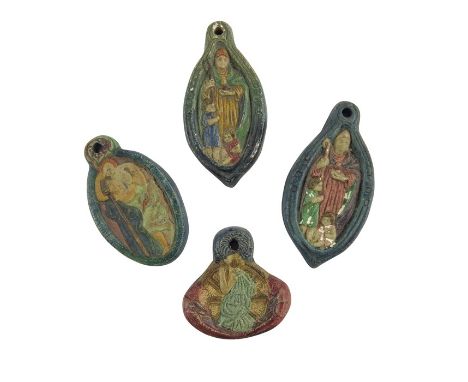 Mary Watts for Compton Pottery, four ceramic pendants, relief moulded, including St Christopher, St Nicholas and St Catherine