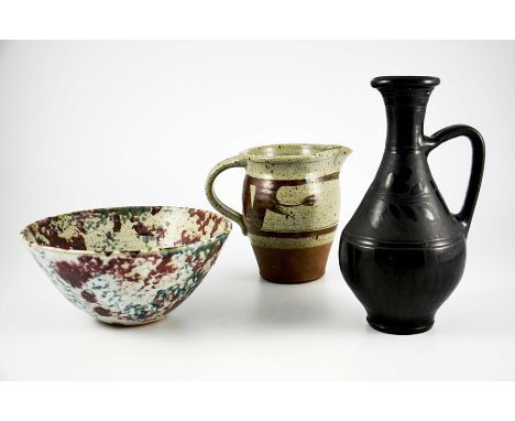 Studio pottery including Donald Granville jug, a mottled slip decorated bowl, and a Nigerian black ware jug, 29.5cm high, 26c