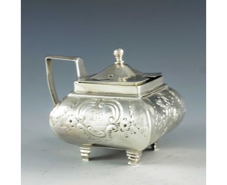 Solomon Hougham, London 1805, a George III silver mustard pot, square section ovoid form, bright cut deocrated with floral fe