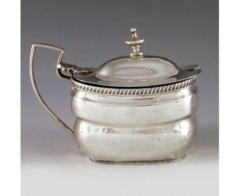 Charles Chesterman II, London 1808, a George III oval silver mustard pot with moulded girdle and gadroon border, the low dome